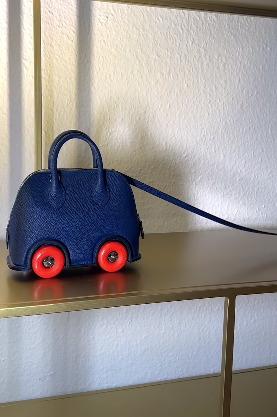 HERMÈS Sac Bolide On Wheels Epsom Bleu Saphir Orange